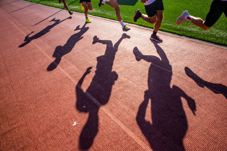 Runners on the track, silhouette, athletics sport photo.